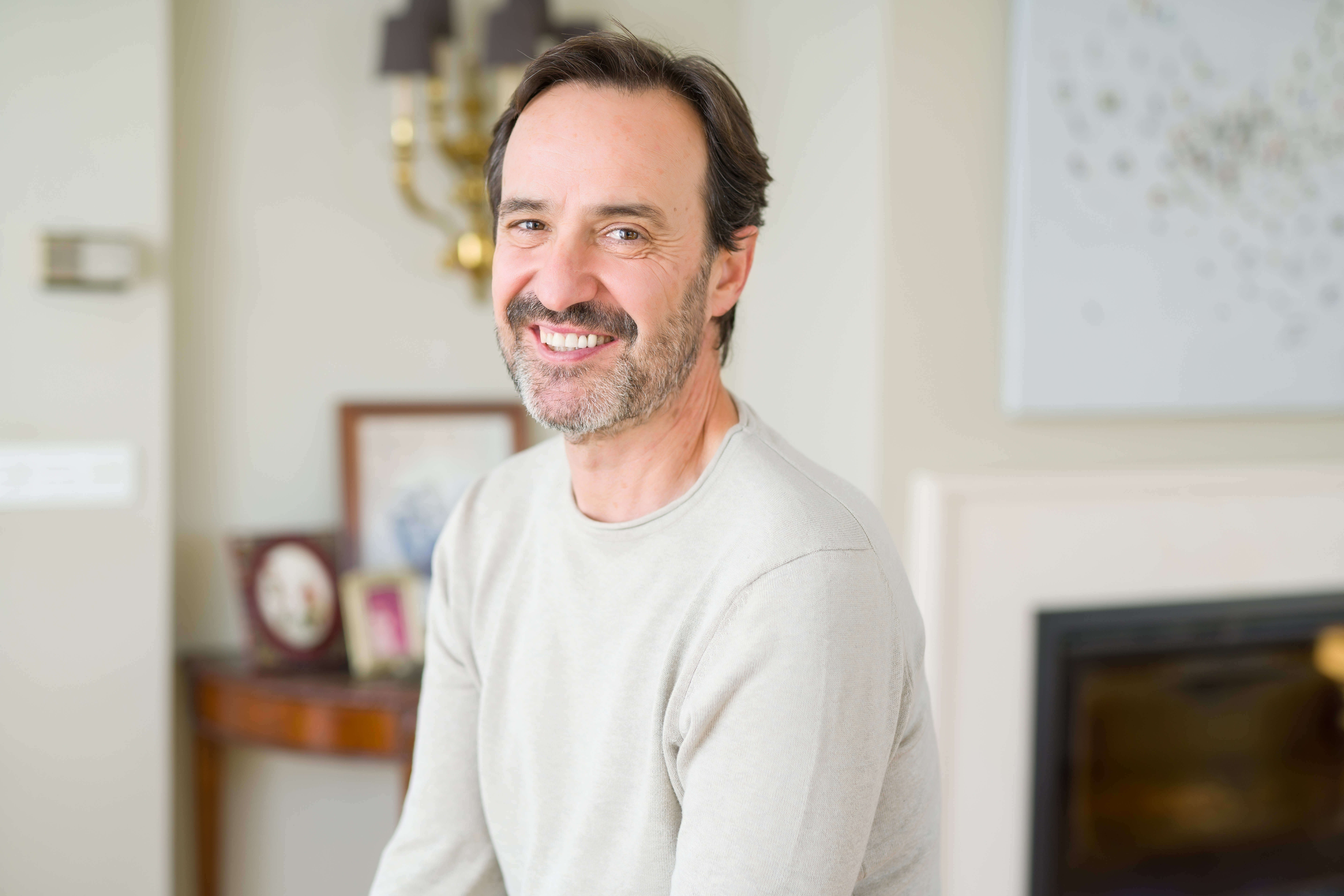 Middle age man smiling with perfect teeth