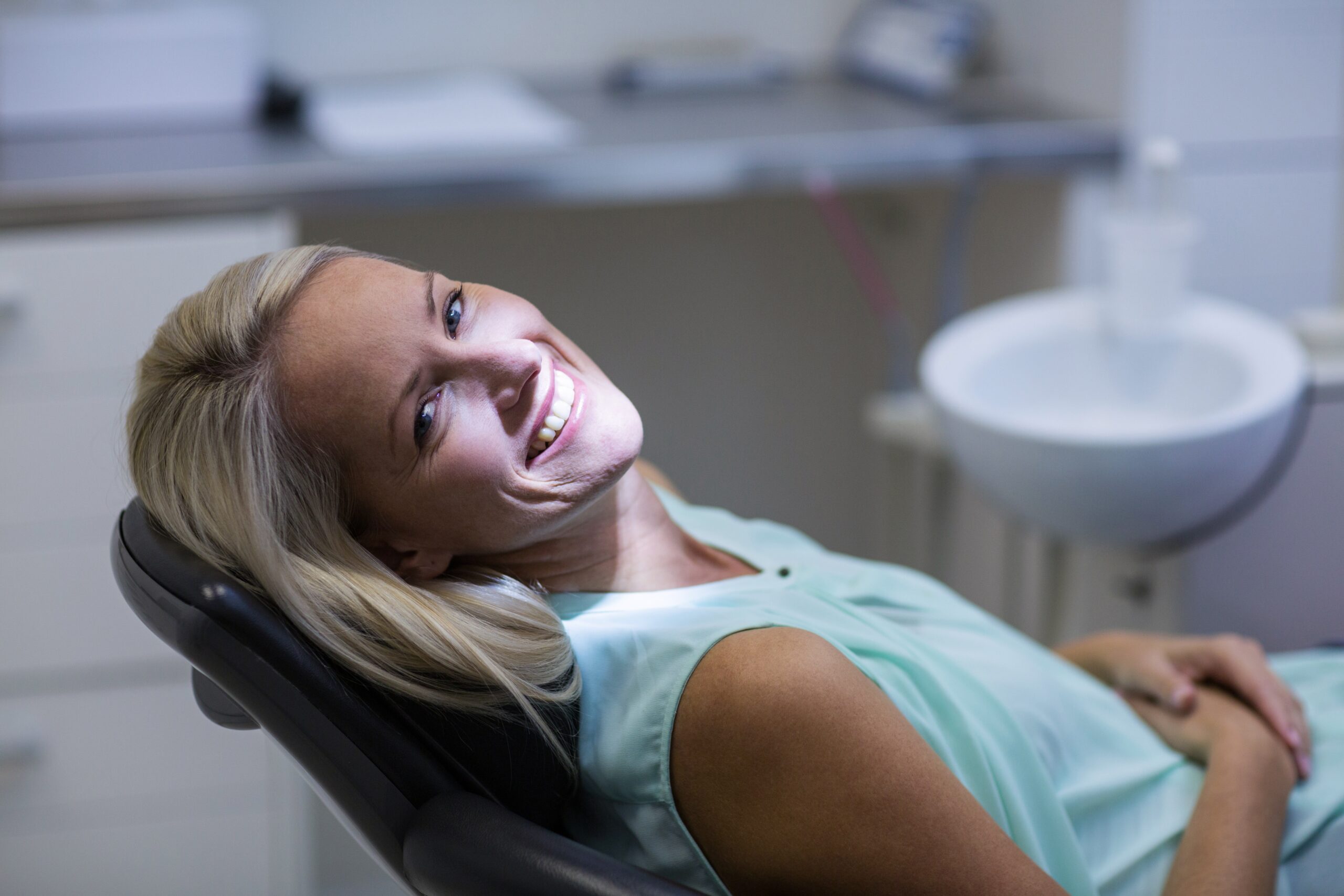 Female dental patient smiling with perfect teeth
