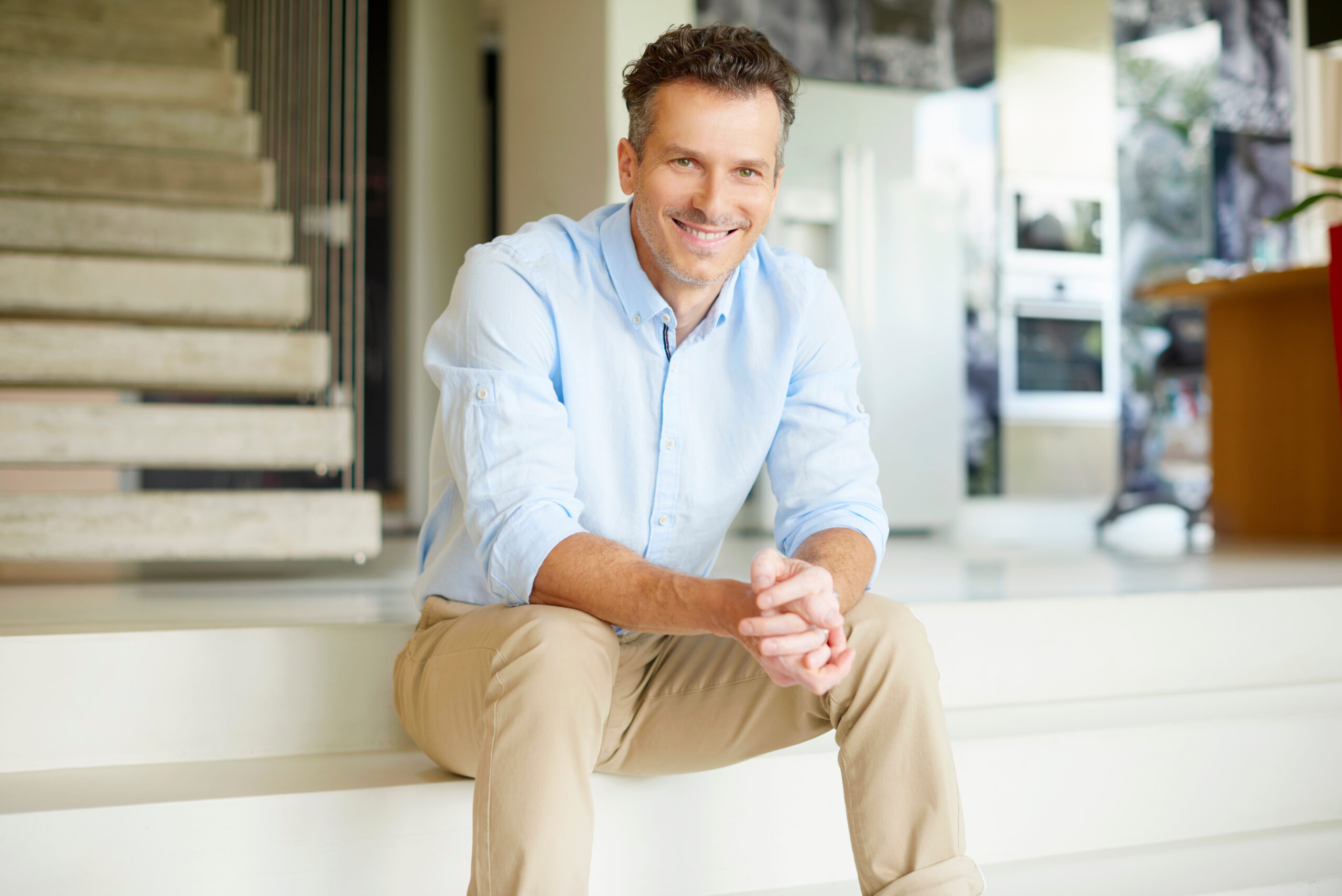Middle-aged man smiling with pearly white teeth