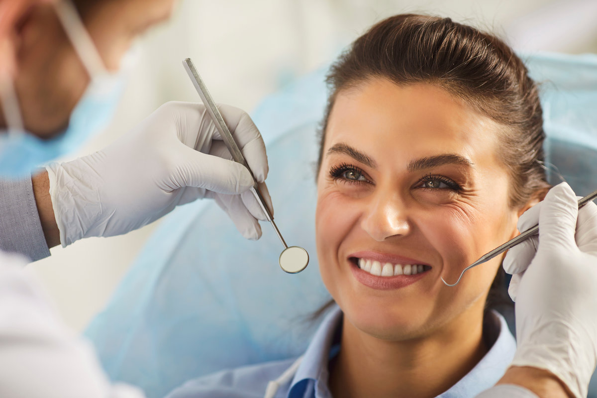 Happy woman visiting dental for clinic oral health treatment, dentist exam, teeth, gums care, smiling healthy girl at doctor visit, whitening teeth procedure result, satisfied with stomatology