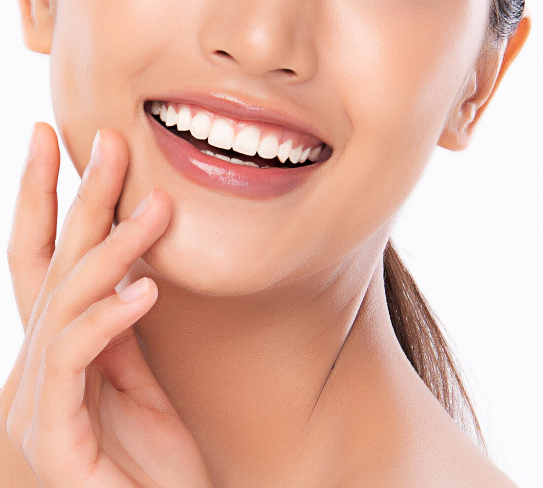 Beautiful smile young woman. White teeth on white background,